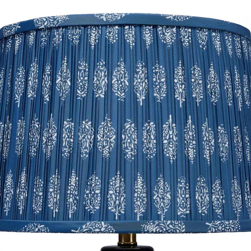 Pleated cotton lampshade on a decorative ceramic table lamp